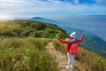 Young people walking on a hilltop in Doi Inthanon, Chiang Mai, Thailand