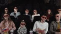 Young people watch movies in cinema: comedy in 3D. Royalty Free Stock Photo