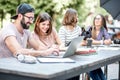 Young people working at the outdoor cafe Royalty Free Stock Photo