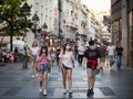 Young people, young man and two young girls, friends, walking wearing face mask protective equipement on Coronavirus Covid 19