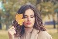 Young perfect female face. Beautiful woman in autumnal park Royalty Free Stock Photo