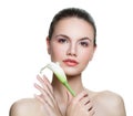 Young perfect woman with clear skin and white flower Royalty Free Stock Photo