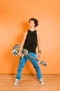 Young performer holding guitar Royalty Free Stock Photo