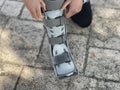 Person adjusting the air of the orthopedic boot used in rehabilitation for foot injury, fracture or ankle sprain