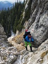 Young person climbing up to Piatra Craiului ridge Royalty Free Stock Photo