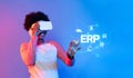 Young person using virtual reality headset interacting with digital ERP interface showcasing enterprise resource Royalty Free Stock Photo