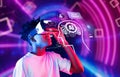 Young Person Using Virtual Reality Headset with AI Interface Display, Digital Graphics, and Futuristic Background XDMCP Royalty Free Stock Photo