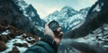 a young person hand holding a compass full of mountains Royalty Free Stock Photo