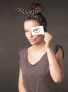 Young person holding paper with angry eye drawing Royalty Free Stock Photo