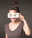 Young person holding paper with angry eye drawing Royalty Free Stock Photo