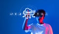Young person interacting with SaaS technology interface on blue background showcasing cloud computing and digital Royalty Free Stock Photo