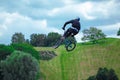 Young person is jumping with his bmx