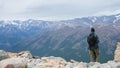 Young person looking at the landscape on the mountain