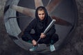 A young person with a metal bat against the background of the propeller Royalty Free Stock Photo