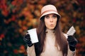 Woman Holding Tea Mug and Pills Treating a Cold in Autumn Season Royalty Free Stock Photo