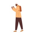 Young person using mobile phone on the go. Black man walking, holding smartphone. African-American guy with cellphone Royalty Free Stock Photo