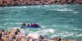 Young persons rafting on the Ganges river in Rishikesh, extreme and fun sport at tourist attraction Royalty Free Stock Photo