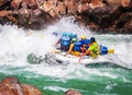 Young persons rafting on the Ganges river in Rishikesh, extreme and fun sport at tourist attraction Royalty Free Stock Photo