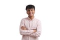 Young peruvian man smile wearing a pink shirt stand with arms crossed, isolated. Royalty Free Stock Photo