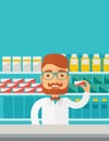 Young pharmacy chemist man standing in drugstore.