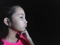 Young Philippina Female Thinking Wearing Pink Isolated On Black