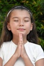 Young Philippina Girl In Prayer Closeup
