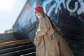 Young photo model working for French magazine wearing red beret