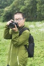 Young photographer in field