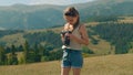 Young girl photographer filming movie