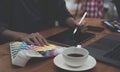 Young photographer and graphic designer at work in office. Blank screen monitor for graphic display montage. Royalty Free Stock Photo