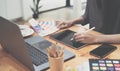 Young photographer and graphic designer at work in office. Blank screen monitor for graphic display montage. Royalty Free Stock Photo