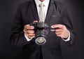 Young photographer man holding camera