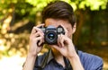 Young photographer with retro film camera