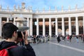 young photographer in Saint Peter Square in Vatican City Royalty Free Stock Photo