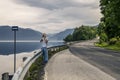 Young photographer is taking a picture in Norway Royalty Free Stock Photo