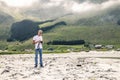 Young photographer is taking a picture in Norway Royalty Free Stock Photo