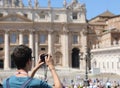 Photographer while taking a picture at Square of Saint Peter in Royalty Free Stock Photo
