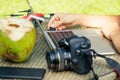 Young photographer woman feeling happy becouse she get money online while sitting at tropical cafe