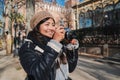 Young photographer woman smiling and shooting a picture on a weekend trip. Happy asian girl having fun taking a photo Royalty Free Stock Photo