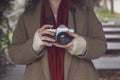 Young photographer woman takes photos with an old analog camera