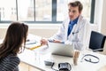 Young physician listening to his patient with respect and dedication Royalty Free Stock Photo