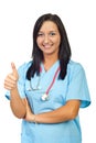 Young physician woman give thumbs