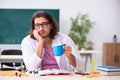 Young male physicist in the classroom