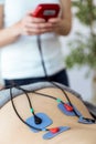 Young physioterapist applying electro stimulation in physical therapy to a patient in physio room. Royalty Free Stock Photo