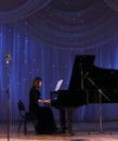 Young pianist for the black grand piano