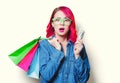 Girl holding shopping bags with money Royalty Free Stock Photo