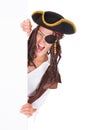 Young Pirate Pointing At Blank Placard Royalty Free Stock Photo