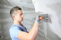 Young plasterer working on wall Royalty Free Stock Photo