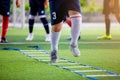 Young player exercises on ladder drills. Royalty Free Stock Photo