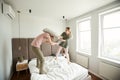 Young playful couple beating each other with pillows Royalty Free Stock Photo
